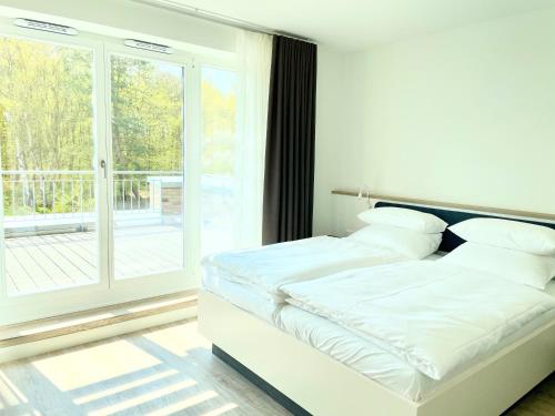 Un pat sau paturi într-o cameră la Villa Wattfuss