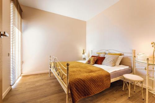 Postel nebo postele na pokoji v ubytování Apartament14 Niegocin