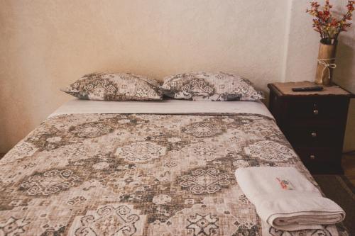 Een bed of bedden in een kamer bij LOS BALCONES PUYO