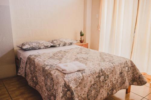 Cama o camas de una habitación en LOS BALCONES PUYO