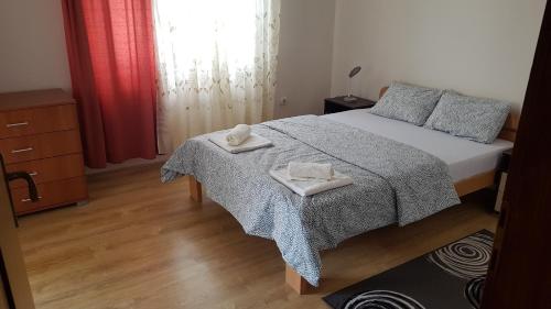 Ένα ή περισσότερα κρεβάτια σε δωμάτιο στο Apartman Jovanović