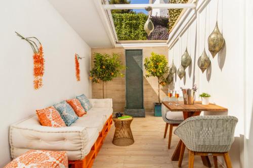 a living room with a couch and a table at Antonio's House in Sitges