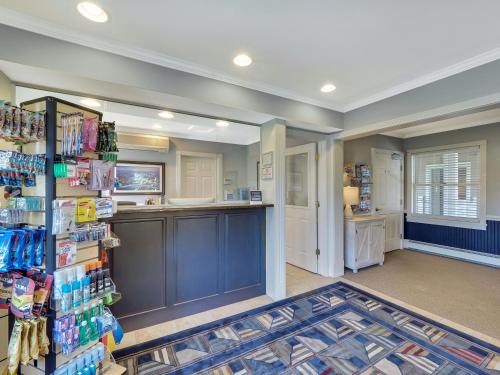 a large room with a kitchen and a pharmacy at 111 Water Street Inn in Boyne City