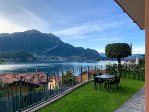 a balcony with a view of a lake and mountains at Residence Molinari Lake Como in Lezzeno