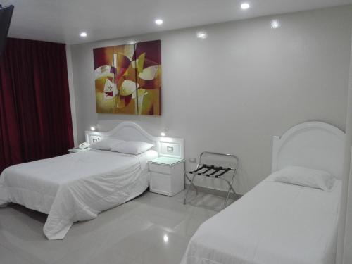 Un pat sau paturi într-o cameră la HOTEL CENTRAL