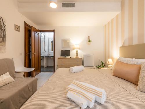 Een bed of bedden in een kamer bij Villa Vaghi Rooms
