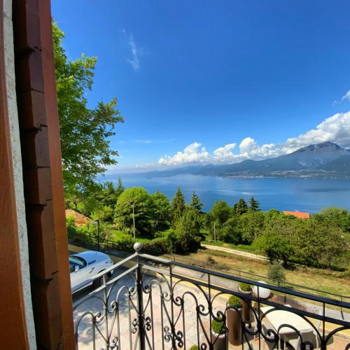 a view of a lake from a balcony at Paradiso Imperfetto Rooms in San Zeno di Montagna