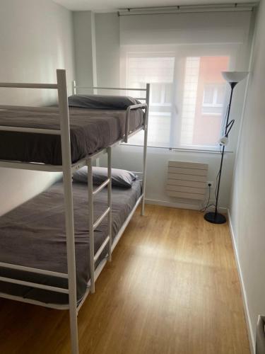 A bed or beds in a room at Piso Lectra 2