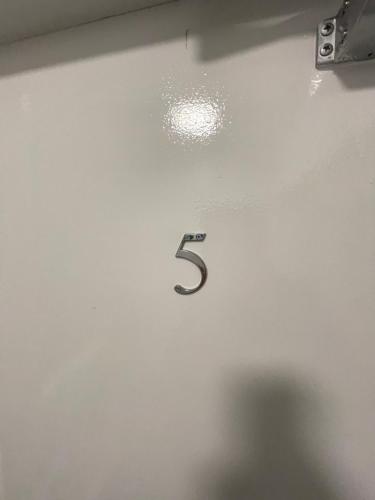 a wall with a number five on it at County serviced accommodation in Liverpool