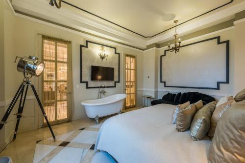 a bedroom with a bed and a bath tub and a camera at Hotel Caribe by Faranda Grand, a member of Radisson Individuals in Cartagena de Indias