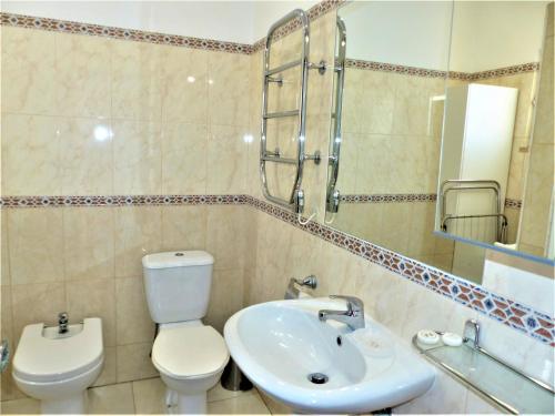 a bathroom with a toilet and a sink at Favorite at Senhora da Rocha in Porches
