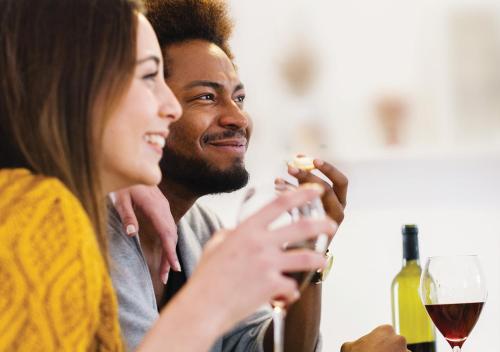 a man and a woman holding a glass of wine at Sudima Queenstown Five Mile in Queenstown