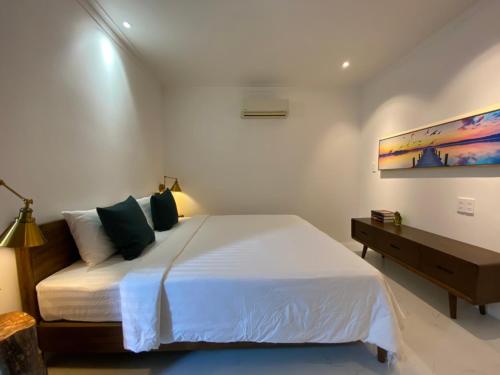 Ένα ή περισσότερα κρεβάτια σε δωμάτιο στο Coco Beach house