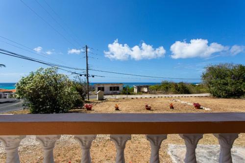 a view of a yard from a fence at Moonlight Cottage in East End Village