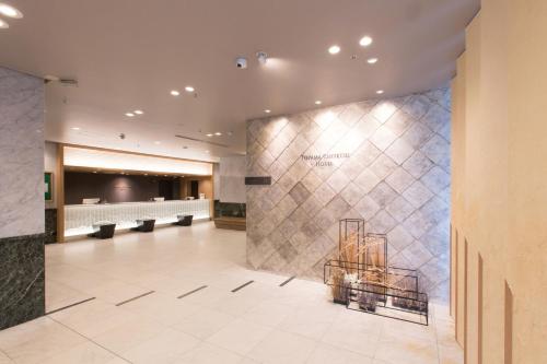 a lobby of a hospital with a waiting room at Toyama Chitetsu Hotel in Toyama