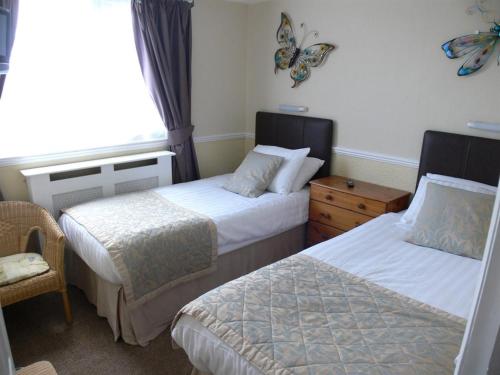 Katil atau katil-katil dalam bilik di Diadem Hotel - Formerly The Shrewsbury Guest House