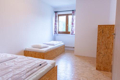 Postel nebo postele na pokoji v ubytování Apartmány Na Výsluní Dolní Morava