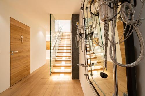 a hallway with a staircase in a house at Hotel Bellerive in Zermatt