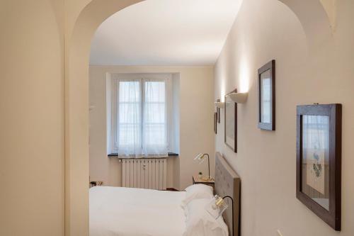 Un ou plusieurs lits dans un hébergement de l'établissement Lovely studio in the city center by Wonderful Italy - NU