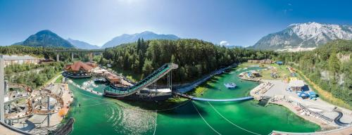 an amusement park with a slide in the water at Boutiquehotel - Michl in Sautens
