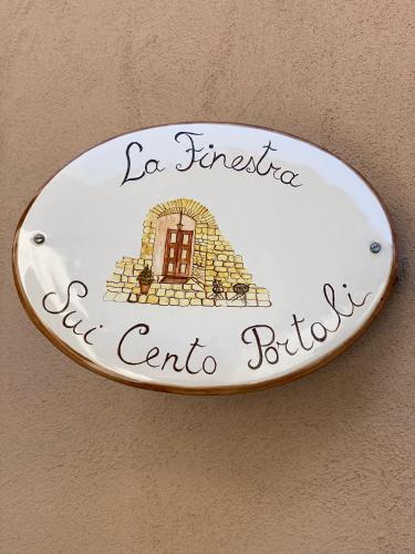 a plate with a door on a wall at I Cento Portali - Albergo Diffuso in Pignola