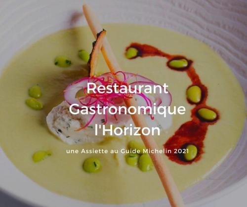 a bowl of soup with peas and food in it at Grand Hôtel Les Flamants Roses Thalasso & Spa in Canet-en-Roussillon