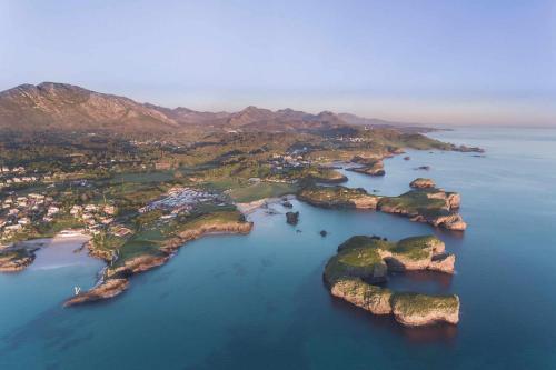 an aerial view of an island in the water at Adosado Marea Baja 1 zona de playa y montaña in Llanes