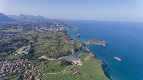an aerial view of an island in the ocean at Adosado Marea Baja 1 zona de playa y montaña in Llanes