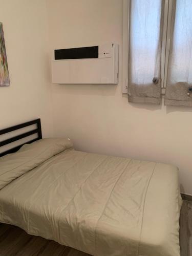 A bed or beds in a room at La stanza nel Borgo