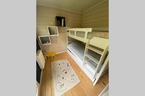 a small room with two bunk beds in it at le bonheur à rive in Comblain-au-Pont