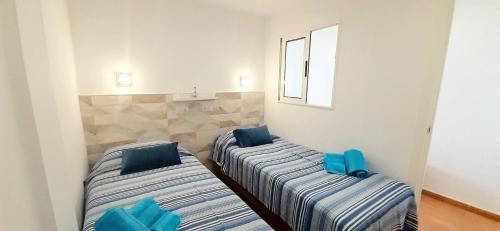 Voodi või voodid majutusasutuse Seven floor at Playa del Ingles toas