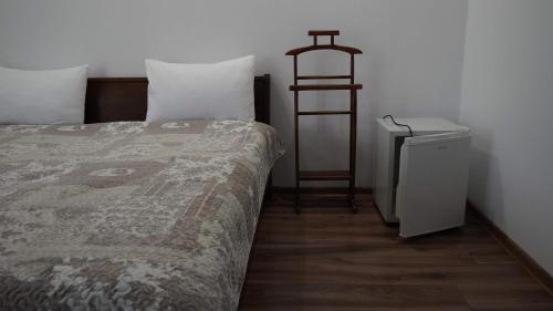 Ein Bett oder Betten in einem Zimmer der Unterkunft El Cairo Cahul