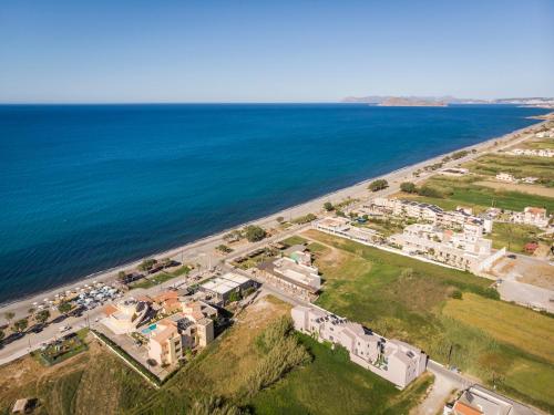 an aerial view of a city and the ocean at Aegean Breeze Luxury Apartments next to the sea in Maleme