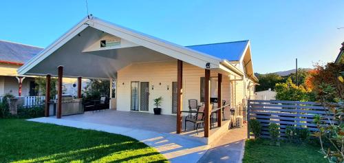 a house with a porch with a patio at Coppers Hill Private Accommodation in Gloucester