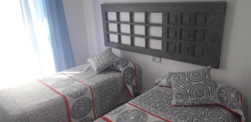 Postel nebo postele na pokoji v ubytování Hotel Sur Utopia