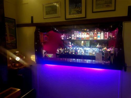 a bar with a bunch of bottles of alcohol at Gabrielles in Blackpool