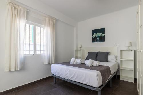 Posteľ alebo postele v izbe v ubytovaní FUN BUILDING PENTHOUSES by HOMEABOUT
