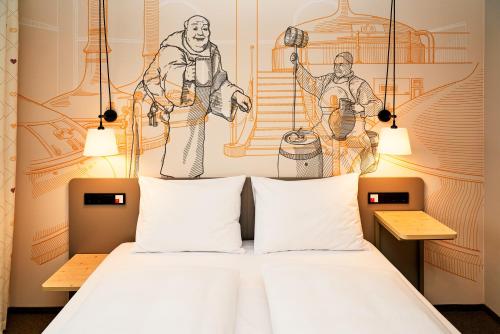 a bedroom with a bed with a drawing on the wall at McDreams Hotel München-Nord in Eching