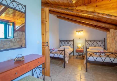 Ένα ή περισσότερα κρεβάτια σε δωμάτιο στο Ammos Villas