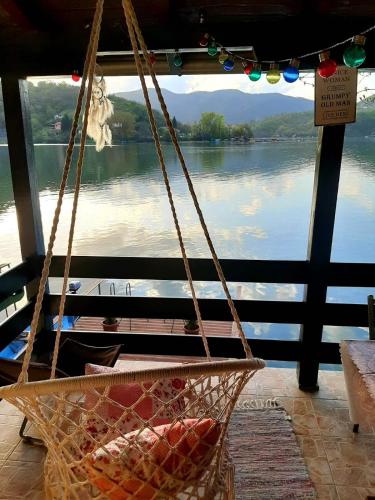 a hanging basket with a view of a lake at Kućica na Jezeru Ovčarsko-kablarska klisura Boat Access Only in Čačak