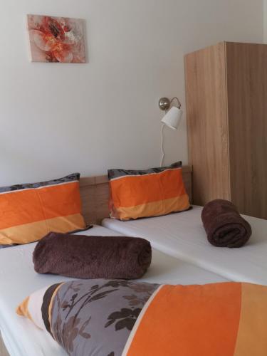 two beds with pillows on them in a bedroom at Tihany Község Önkormányzat - Ifjúsági Szállás in Tihany