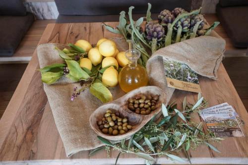 a table with a bunch of fruits and vegetables on it at B&B il Pianolo in Perinaldo