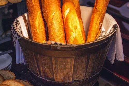 a bucket of bagels sitting on a table at Clarion Hotel Real Tegucigalpa in Tegucigalpa