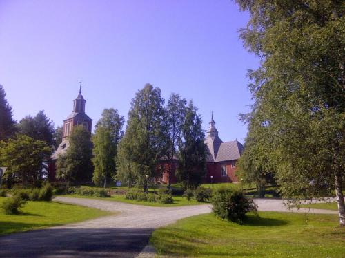 a road leading to a building with two towers at Hotel Ilomantsi North Star in Ilomantsi