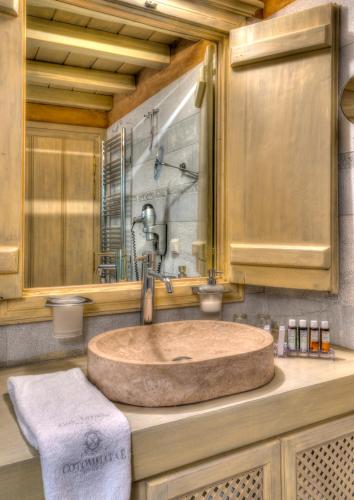 a bathroom with a large sink in a bathroom at Cotommatae Hydra 1810 in Hydra