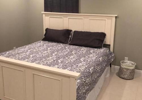 a bed with two pillows on it in a room at Luxury Venetian Condo in Nassau