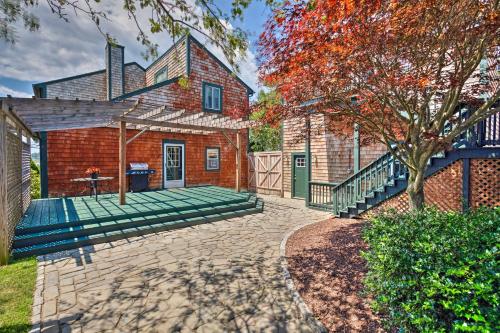 an exterior view of a brick house with a bench at Coastal Abode with Beach Views, Walk to Beach and Bars in Middletown