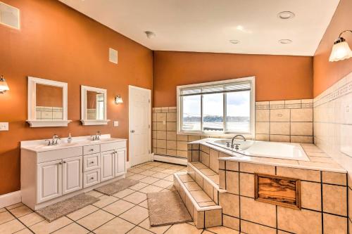 a large bathroom with two sinks and a tub at Coastal Abode with Beach Views, Walk to Beach and Bars in Middletown