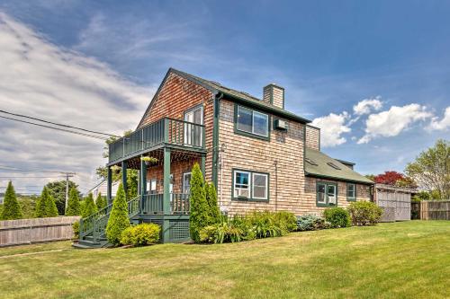 a large brick house with a yard at Coastal Abode with Beach Views, Walk to Beach and Bars in Middletown