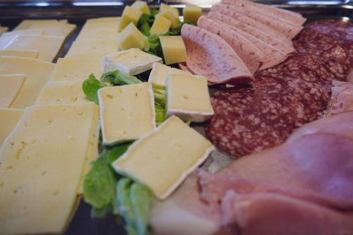 a tray of cheese and other meats and cheeses at Gasthaus Amboss in Ravensburg
